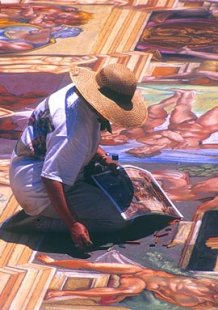 image of Genna Panzarella re-creating a section of Michelangelo's Sistine Chapel ceiling in 2003; photo by Dean Lipoff